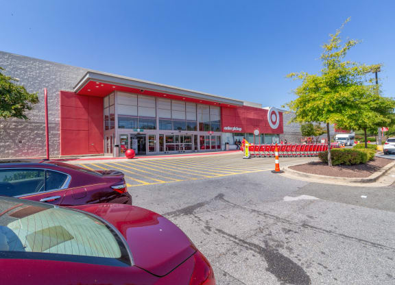 a red car parked in front of a building at Fairmont at South Lake, Bowie, MD