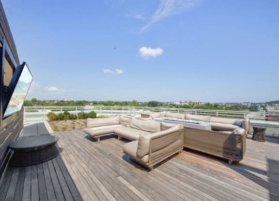 a terrace with couches and a table on a roof at Park Kennedy, Washington