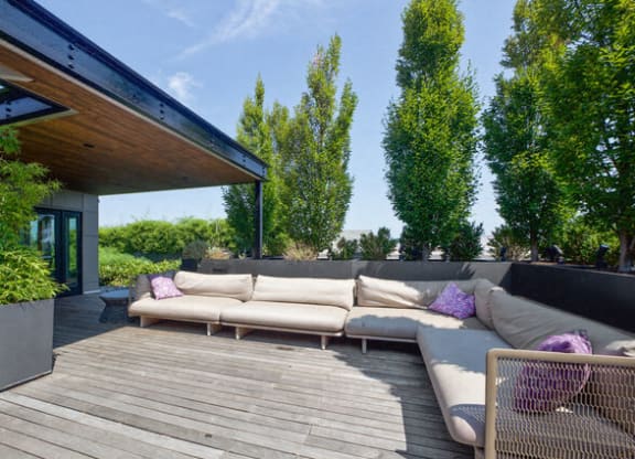 a patio with couches on a wooden deck at Park Kennedy, Washington, Washington