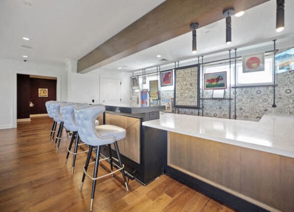a kitchen with a bar and stools at Park Kennedy, Washington, 20003