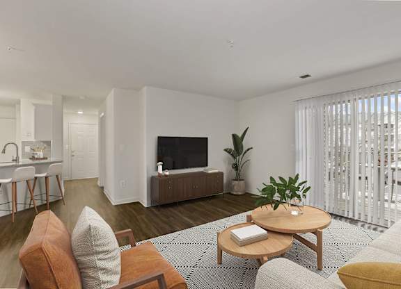 Living room with balcony at The Fields of Manassas