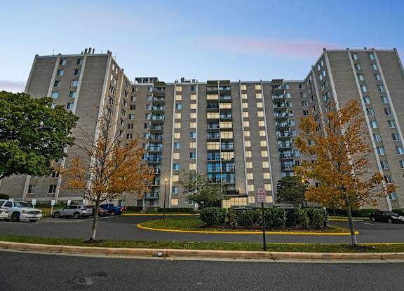 A large apartment building with a parking lot in front at Avondale Overlook, Hyattsville, 20782