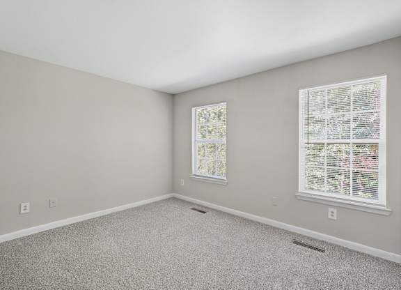 Carpeted Bedroom at Greens at Stonecreek, Lithonia, Georgia