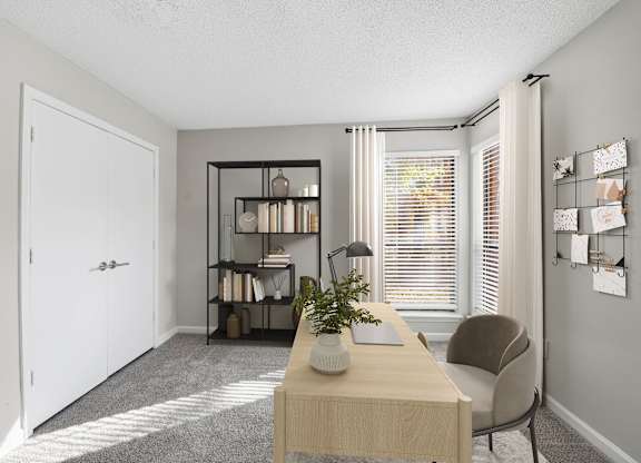 A room with a desk, chair, and bookshelf at Brampton Moors, Cary, NC, 27513