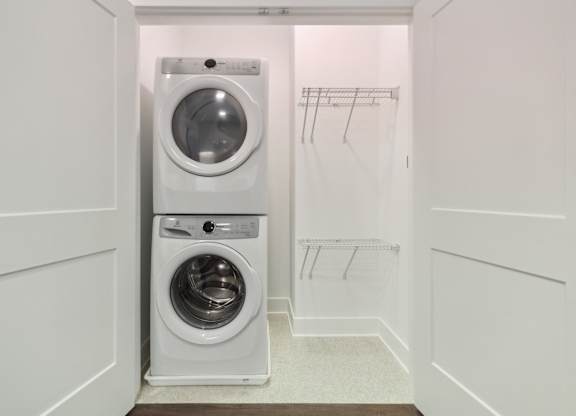 A white laundry room with a washer and dryer. at The Sully, Chantilly, VA, 20151