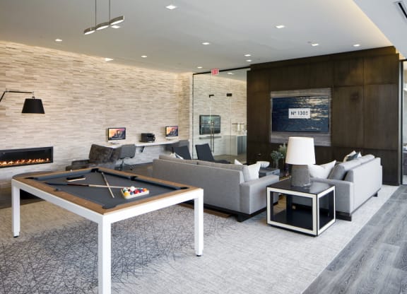 a living room with a pool table and a fireplace at 1305 Dock Street, Baltimore, MD