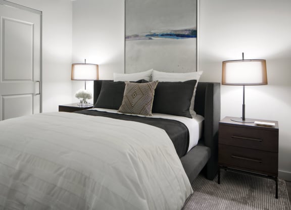 a bedroom with a bed and two lamps at 1305 Dock Street, Maryland