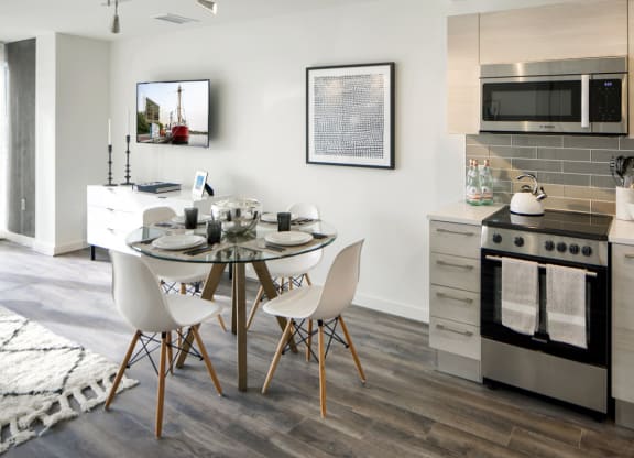 a kitchen and dining room with a table and chairs at 1305 Dock Street, Baltimore, MD