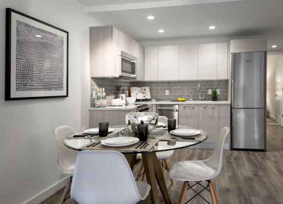 a kitchen and dining room with a table and chairs at 1305 Dock Street, Maryland