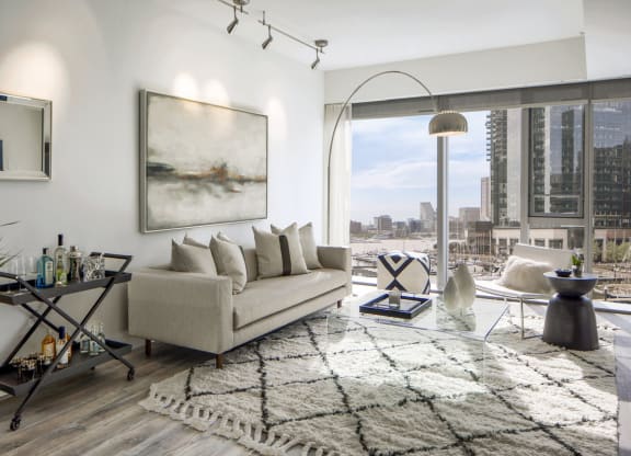 a living room with a couch and a view of the city at 1305 Dock Street, Baltimore