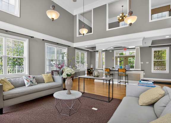 A living room with a grey couch and a coffee table.