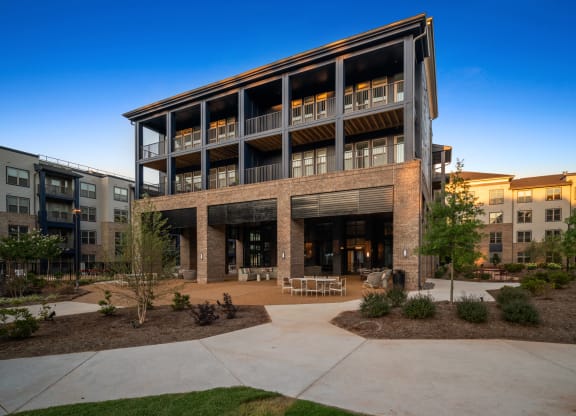 an office building with a courtyard in front of it at Preston Ridge, Cary, NC, 27513
