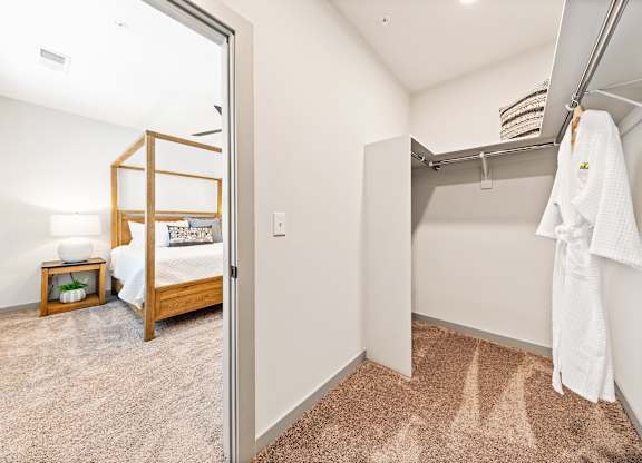 A white towel is hanging on a rack in a room.