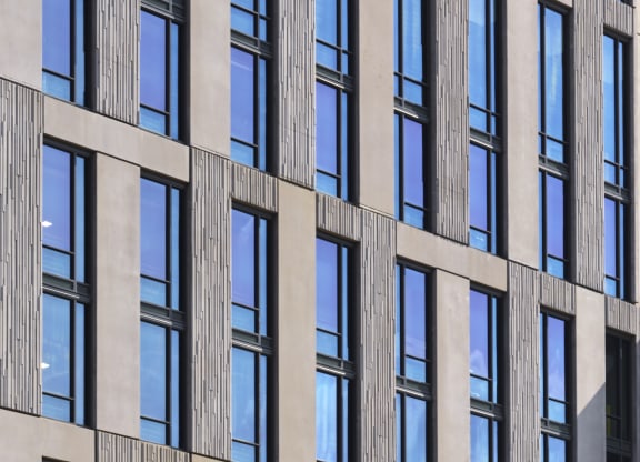 a close up of a building with many windows at The Boro, Tysons, 22102