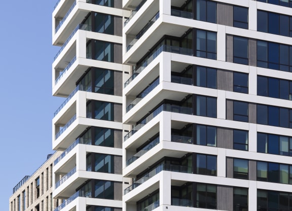 a close up of the facade of a high rise building at The Boro, Tysons