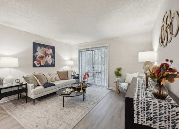 our apartments offer a living room with a couch and a table at St. Andrews Reserve, North Carolina, 28412