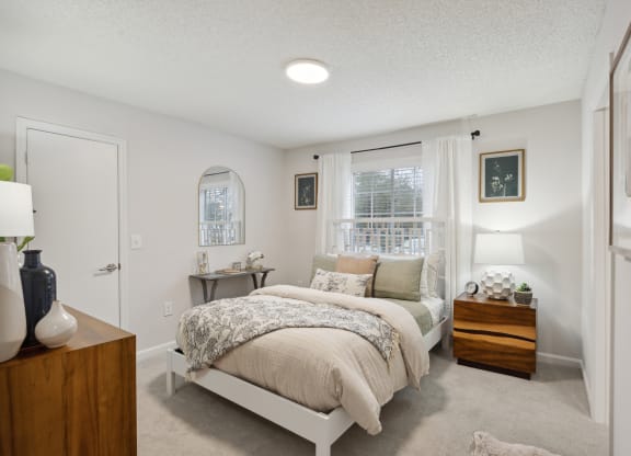 a bedroom with a bed and a window at St. Andrews Reserve, North Carolina