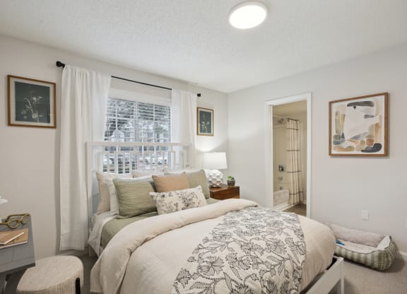 a bedroom with a large bed and a window at St. Andrews Reserve, North Carolina, 28412