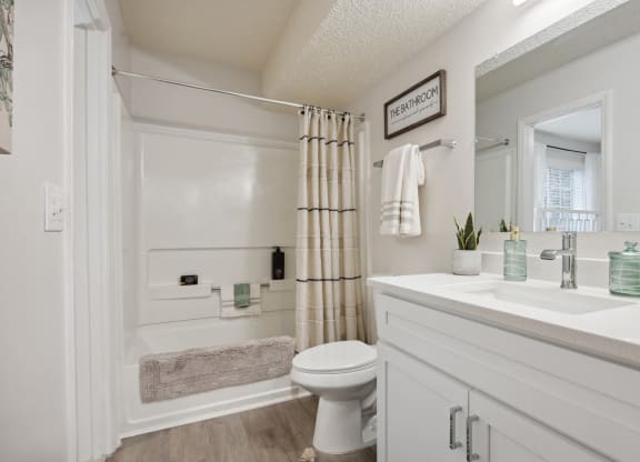 a bathroom with a shower and a sink and a toilet at St. Andrews Reserve, Wilmington, 28412