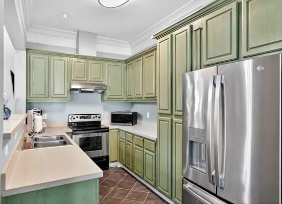 Kitchen with Green Cabinets at Alexander Ridge Apartments, Canton, 30114