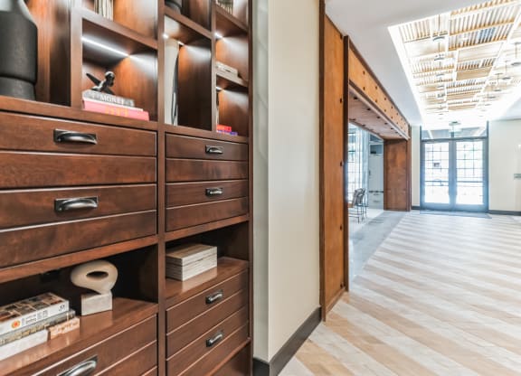 a closet with wooden drawers and a wood floor at Hawkins Press, North Carolina, 28203