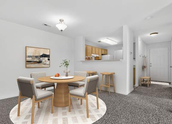 A dining room with a round table and chairs.