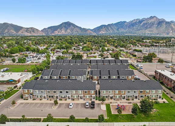 A large building with a parking lot in front of it.