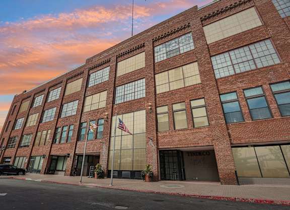 A red brick building with the word Tindeco on the front.