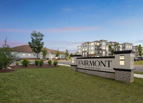 The image shows a sign that says Fairmont at South Lake in front of a building.