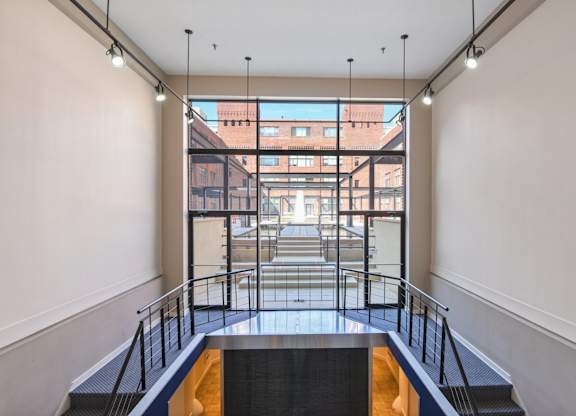 A view from the inside of a building looking out onto a city street.