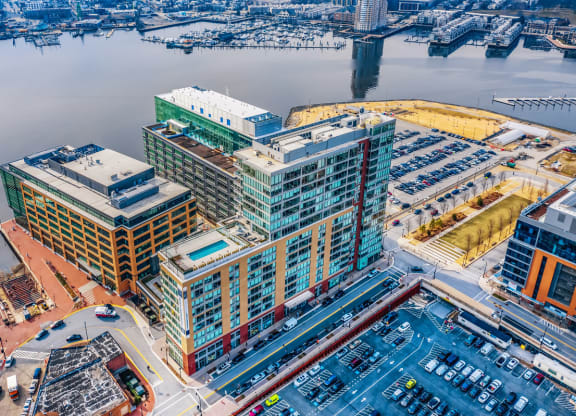 an aerial view of a city with tall buildings and a harbor at 1405 Point Street Apartments in Baltimore, MD