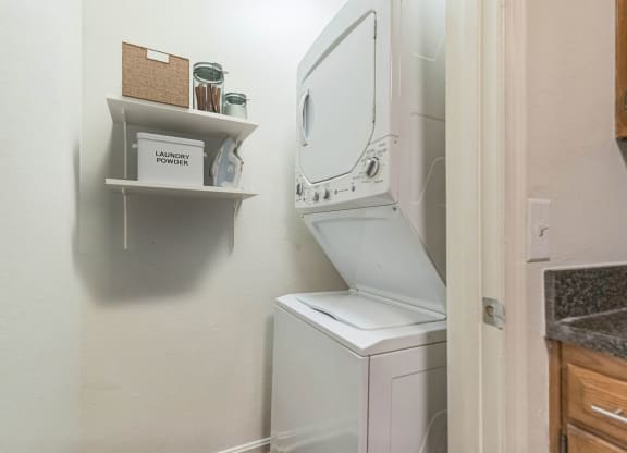 the washer and dryer in the laundry room of a small home at Sanger Place, Lorton, 22079