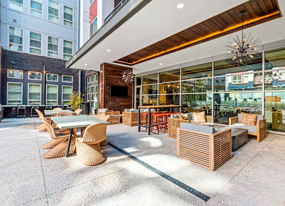 a patio with tables and chairs outside of a restaurant