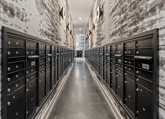 a long hallway with rows of filing cabinets in a data center with white brick walls  at South and Hollis, Charlotte, NC, 28209