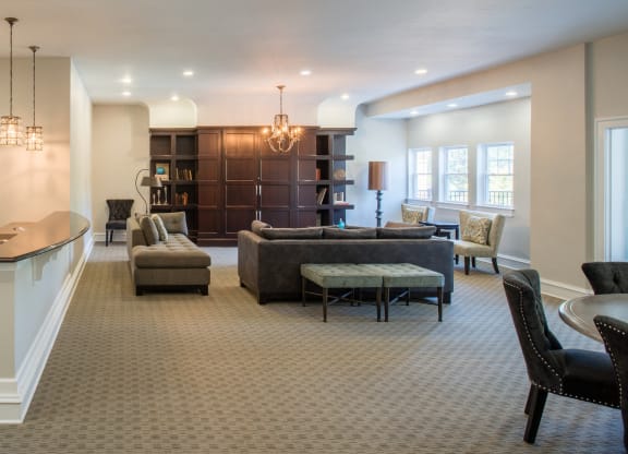 Resident clubhouse with lounge area and kitchen area with breakfast bar at Amberleigh apartments in Fairfax, Virginia 22031