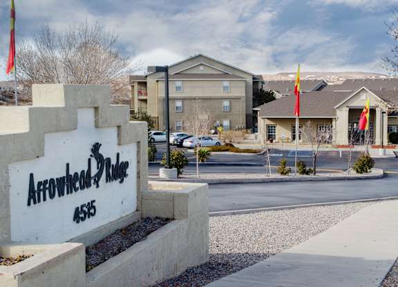 The Arrowhead Ridge sign is in front of a building at Arrowhead Ridge Apartments, Rio Rancho, 87124