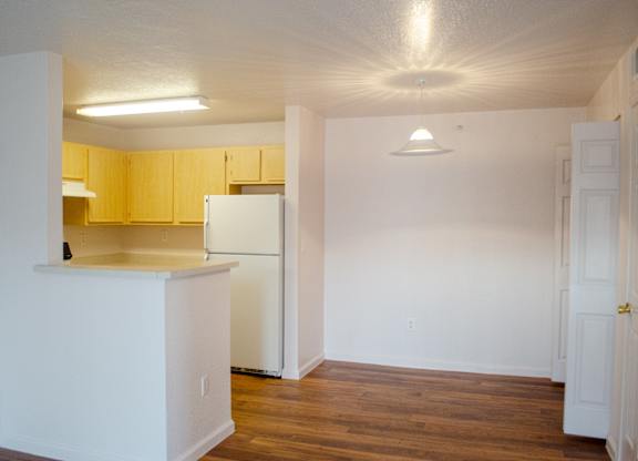 A kitchen with white cabinets and a white refrigerator at Arrowhead Ridge Apartments, Rio Rancho, NM, 87124