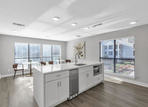 an open kitchen and dining room with a large window  at Brampton Moors, Cary, 27513