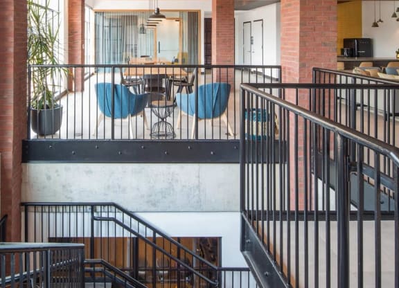 the interior of a building with stairs and a dining room at Reed Row, Washington, DC