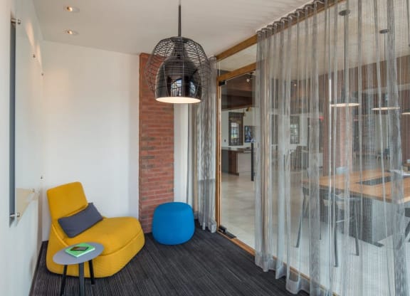 a lounge area with chairs and a glass door at Reed Row, Washington, Washington DC