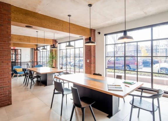 a dining room with tables and chairs and large windows at Reed Row, Washington, Washington DC