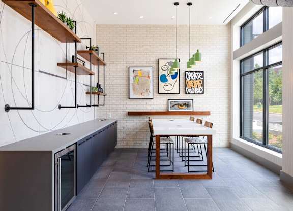 a kitchen with a long table and a large window at The Chase at Bryant Street, Washington