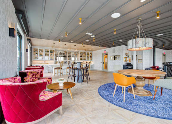a lobby filled with chairs and tables and a large chandelier at Coda at Bryant Street, Washington, DC