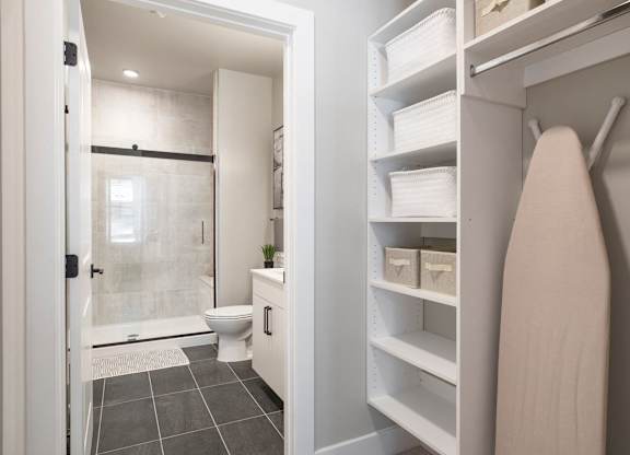 a bathroom with a shower and a towel rack in a closet at Coda at Bryant Street, Washington, DC 20002