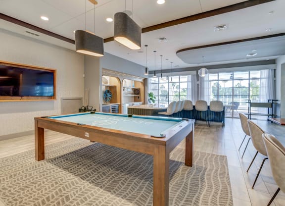 a games room with a pool table and a flat screen tv at Delamarre at Celebration, Celebration