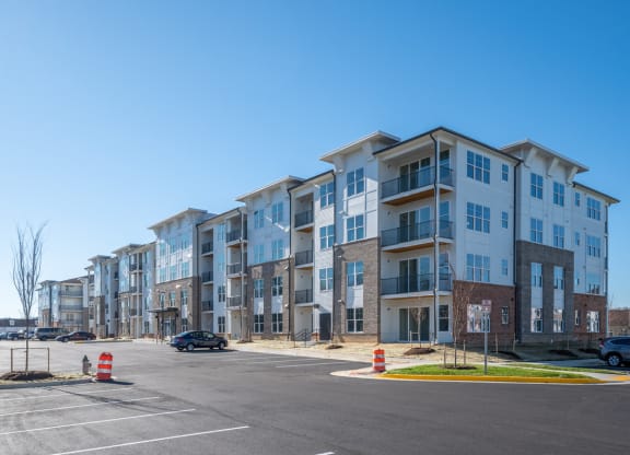a large apartment building on the corner of a parking lot at Fairmont at South Lake, Maryland, 20716