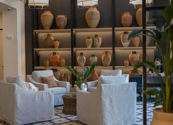 a living room filled with chairs and vases  at La Unión, Florida