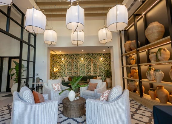 a living room with couches and chairs and a wall filled with vases  at La Unión, Tampa, 33605