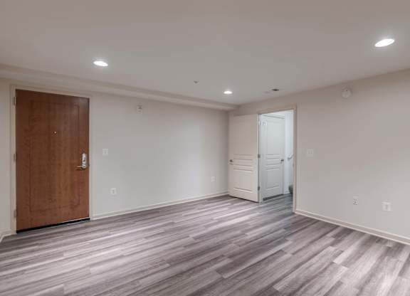 A room with a wooden floor and a white door at Garfield Park, Arlington, 22201