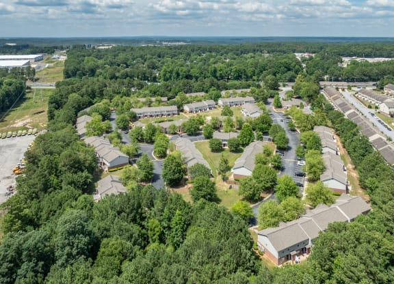 an aerial view of a neighborhood with houses and trees at Greens at Stonecreek, Lithonia, GA